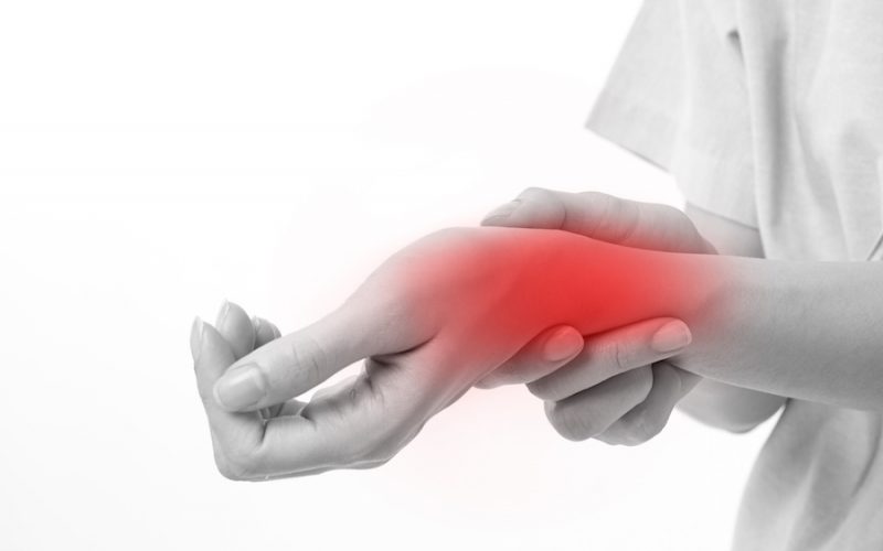 woman suffering from wrist joint pain, arthritis, gout